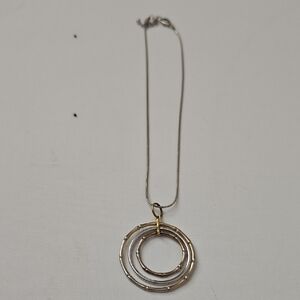 Elegant Gold and Silver Pendant Necklace